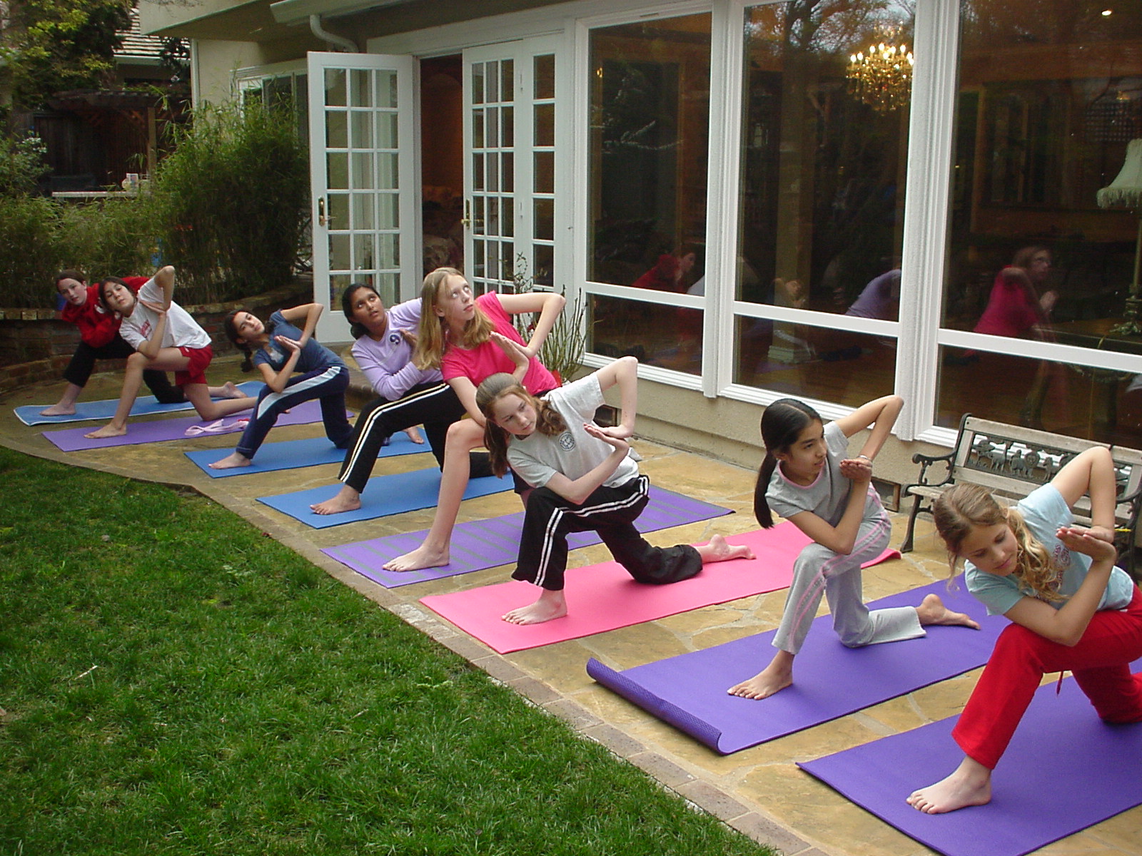 Preteen Girls in Sun Salutation